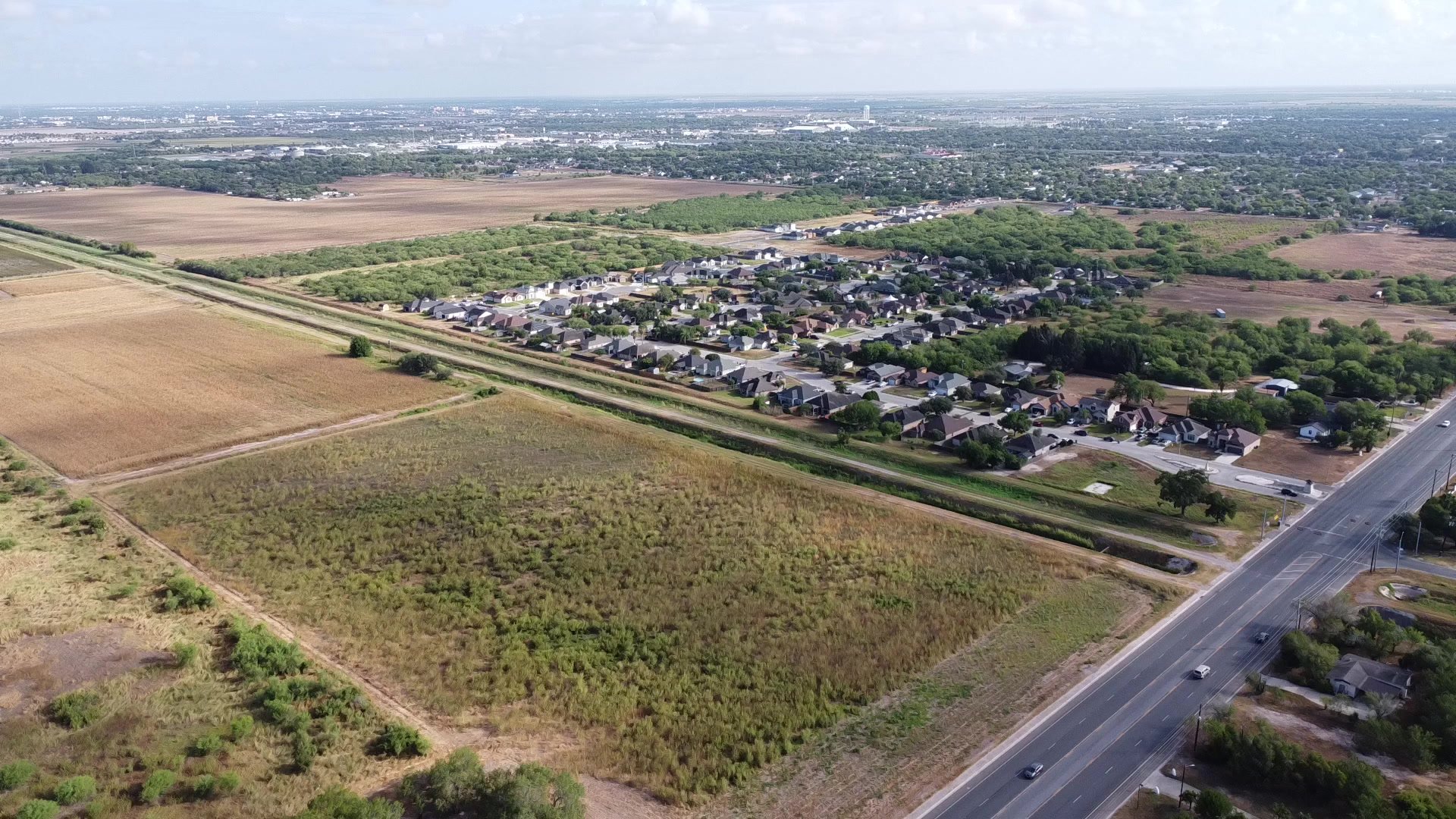 Aerial toward neighborhood and road