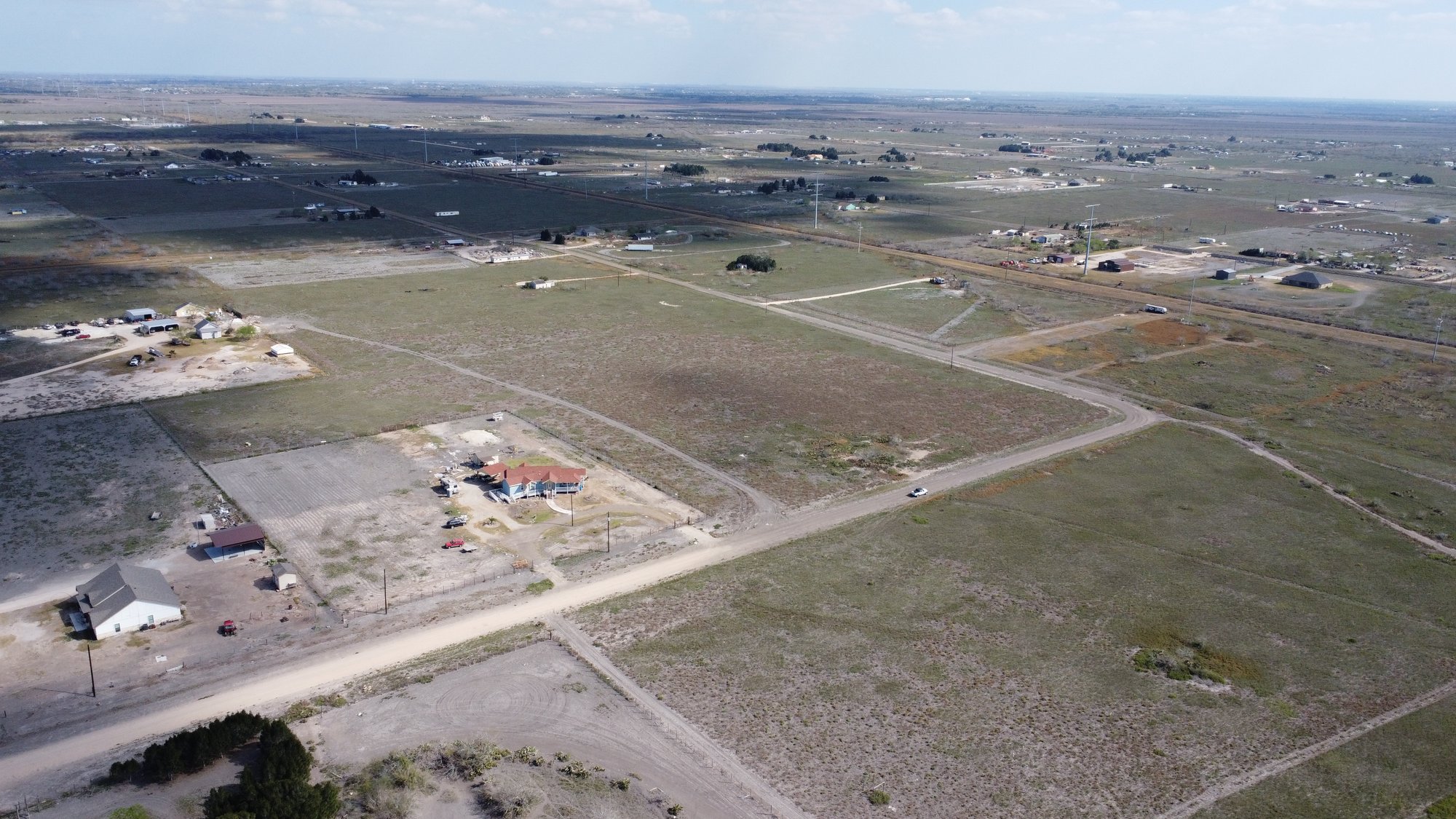 Aerial of lots and gravel road