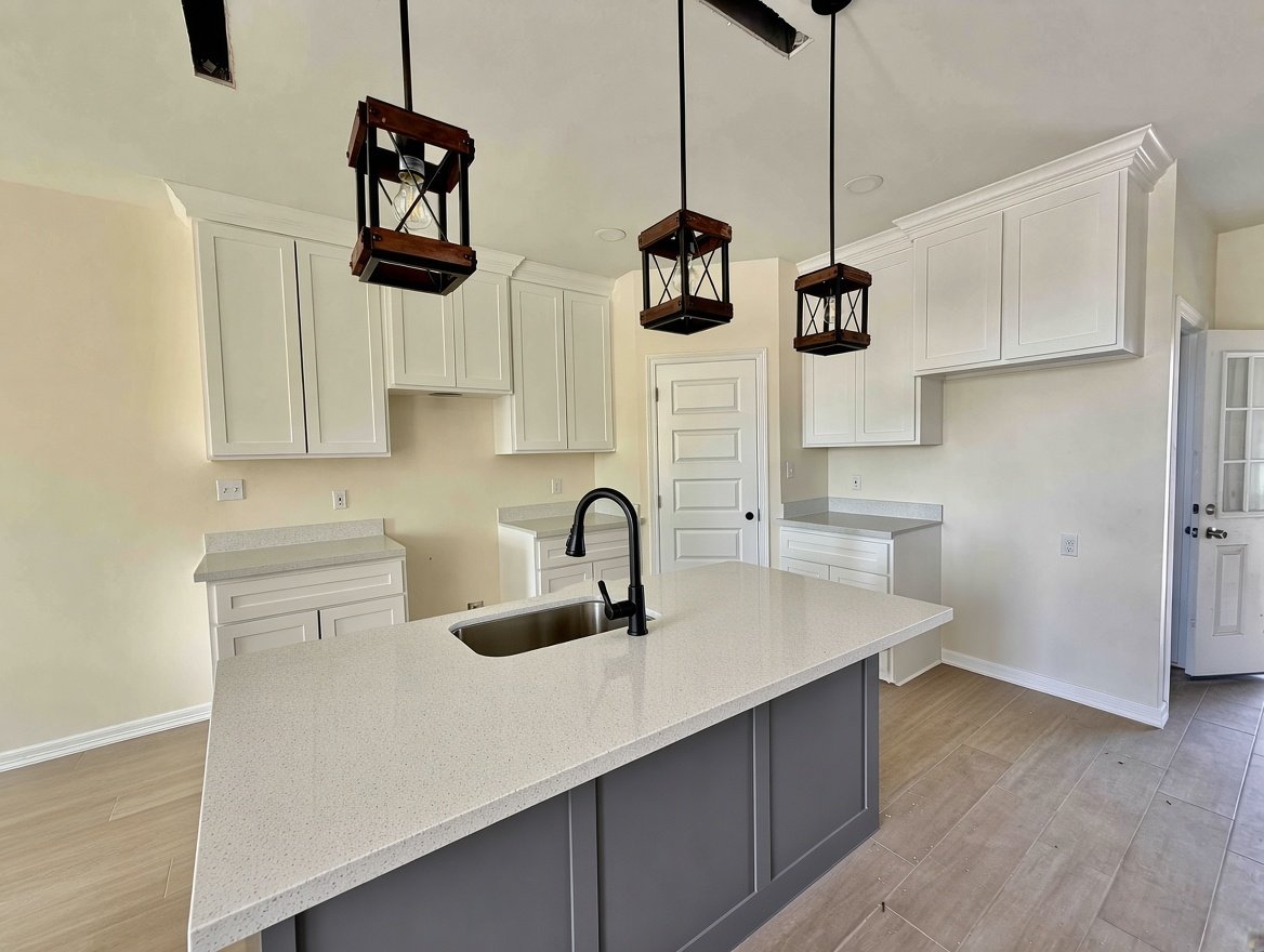 Kitchen with island and pendant lights